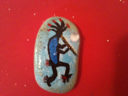 Image of Kokopelli in red and blue