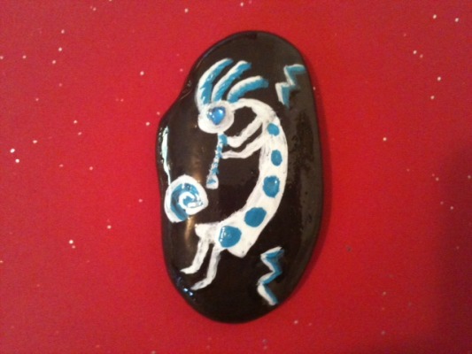 Image of Kokopelli in blue and white